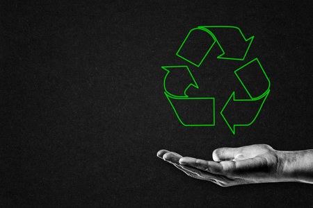 Hand in Black and White with Green Recycle Symbol, Copy Spaceの写真素材