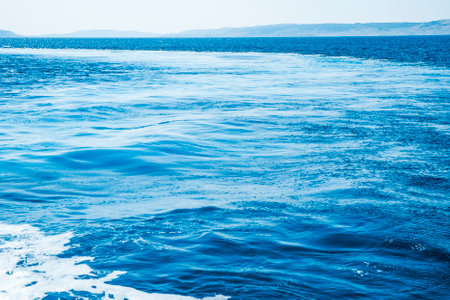 Blue Surface of Ocean Horizon Backgroundの写真素材