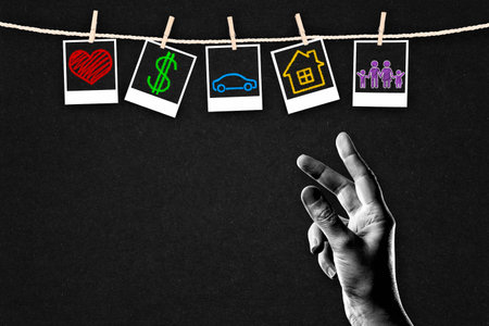 Hand in Black and White Choosing Between Different Life Values as Family vs Career on Textured Paper Background, Copy Spaceの写真素材