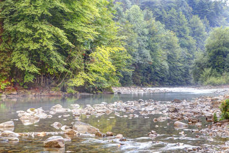 Rising mist over mountain river in the morning light,Summer in the Allgäu 