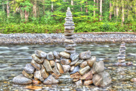 Stone tower in the mountain river in the evening light is