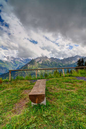 Bench in the Alps in summerの写真素材