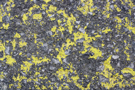 Surface of a road surface with marking paint that is badly worn の写真素材