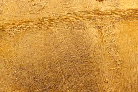 Vintage gilded or old gilding is partially peeled off and cracked.の写真素材