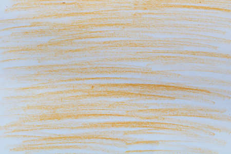 Orange chalk slices on papeの写真素材