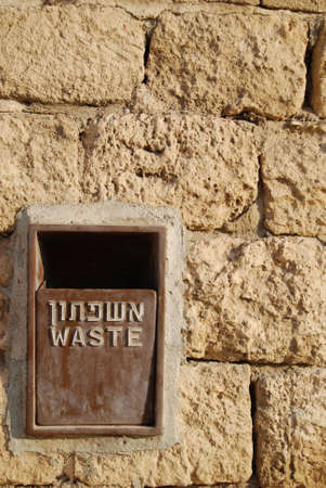 Iron waste in wall from old stones in israelの写真素材