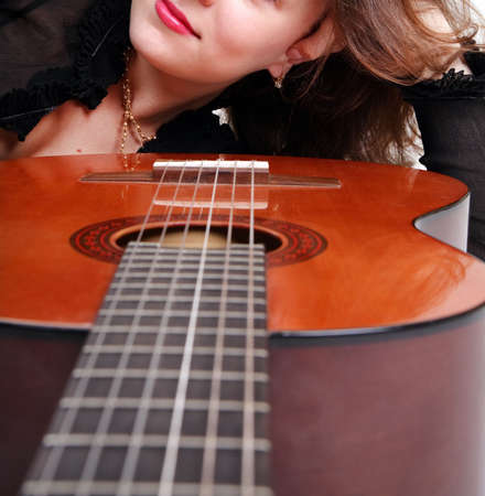 gira are smiling, and the guitar musical instrumentの写真素材