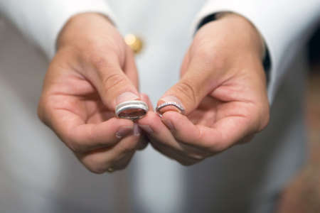 man is Holding Wedding rings in the handsの写真素材