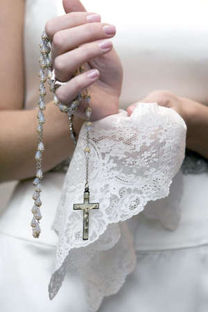bride holding cross on the wedding ceremonyの写真素材