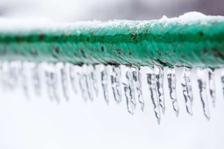 Frozen icy down pipe, iciclesの写真素材