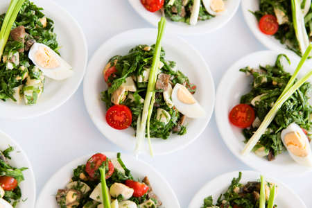 Many plates of vegetable saladの写真素材