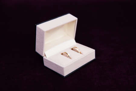 Gold wedding rings in the box for rings