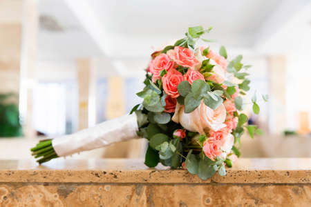 Beautiful bridal bouquet of different flowers with eucalyptus leavesの写真素材