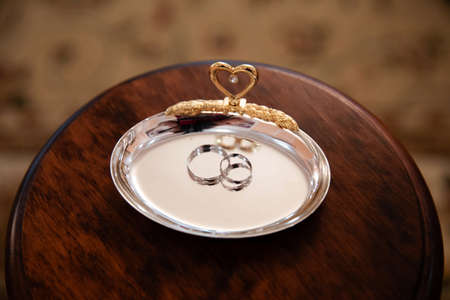 Engagement gold rings on the stand for ringsの写真素材