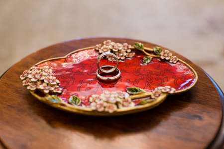 Gold wedding rings on stand for rings