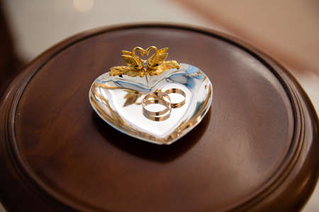 Gold rings for wedding ceremony on a standの写真素材