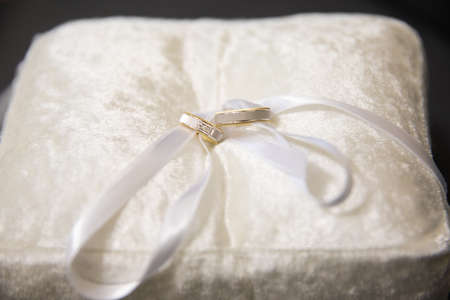 Gold rings for wedding ceremony on a standの写真素材