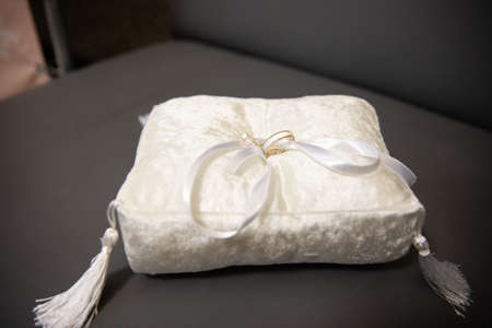 Gold rings for wedding ceremony on a standの写真素材