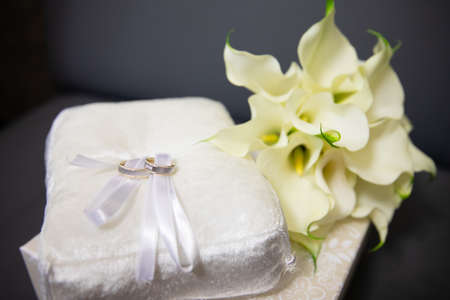 Gold rings for wedding ceremony on a standの写真素材