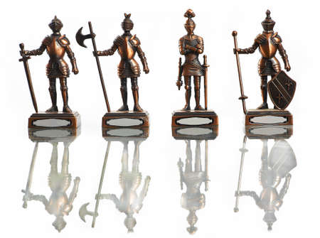 four figures of knights isolated on whiteの写真素材