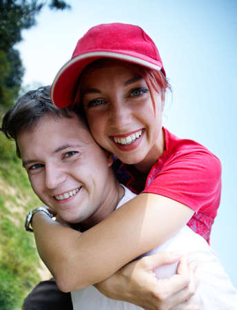 young happy coupleon vacation, piggybackの写真素材