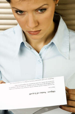 Young caucasian businesswoman received the notice of layoff