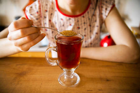caucasian woman is having her morning teaの写真素材