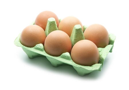 eggs in green box isolated on white background