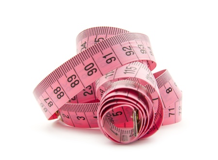 pink measuring tape isolated on white backgroundの写真素材