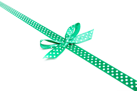green ribbon with dots isolated on white background, copy spaceの写真素材
