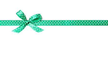 green ribbon with dots isolated on white background, copy spaceの写真素材