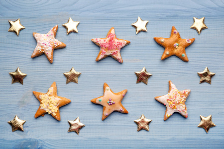 Gingerbread cookies on blue wooden backgroundの写真素材