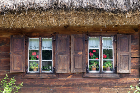 Old wooden house with window shuttersの写真素材