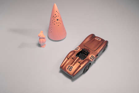 Pink bear, conical tower and nice toy car.