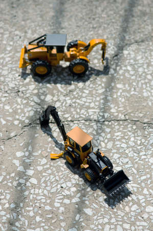 Two lines of electric shadows and two fork-loops on the cement floor.の写真素材