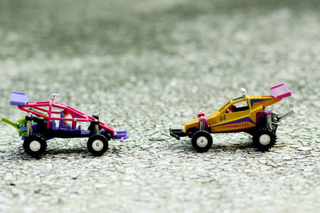 A small off road toy car for 1 person is on the cement floor.の写真素材