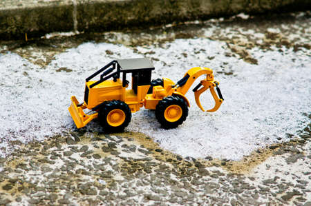 In December 2017, a fork-worker working in a place covered with ice downstream.の写真素材
