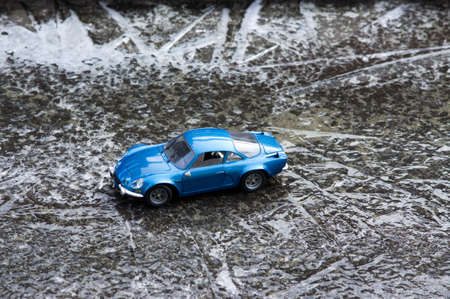 The blue toy car runs on the ice for wherever you go.の写真素材