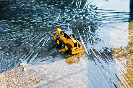 A toy folklore on a winter icy road.の写真素材