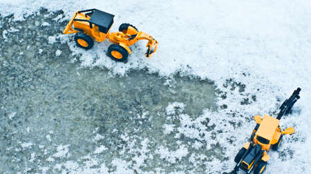 Looking down from the top of the winter forklift on snow and ice.の写真素材