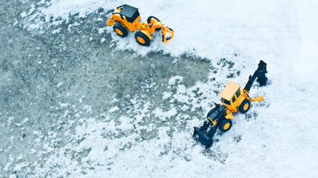Looking down from the top of the winter forklift on snow and ice.の写真素材