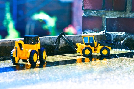 Two fork-lifts repairing the bridge walls.の写真素材