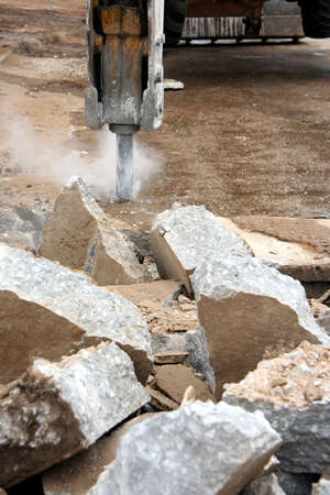 A impact digger breaking up concreteの写真素材