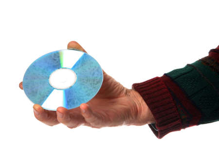 Man's hand holding a compact disk in his fingersの写真素材