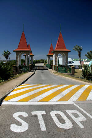 Stop painted on road before narrow one way bridge
