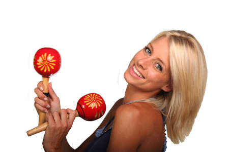 Pretty blond woman with red shakers for rythum in music