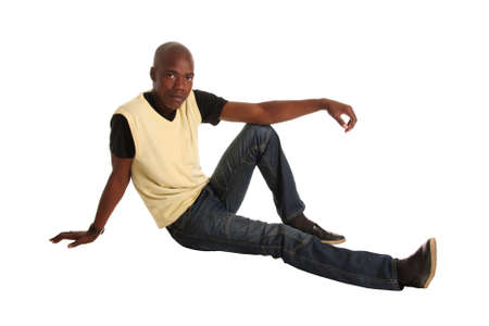 Handsome young casually dressed African man laying down