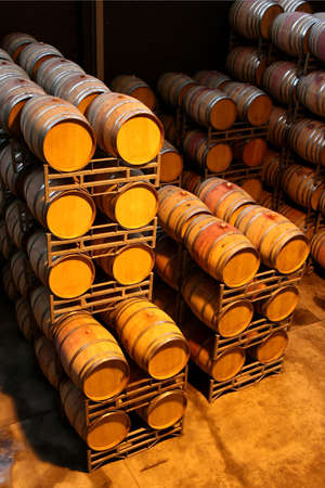 Barrels or vats of red wine in an aging cellar