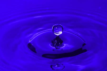 Water drop splash making the shape of a crownの写真素材