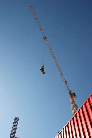 Building site with steel structures and crane overheadの写真素材